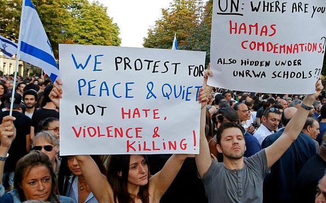Demonstrators hold pro-Israel placards during a gathering in front of the Israeli Embassy in Paris, France, Thursday, July 31, 2014. (AP Photo/Francois Mori)