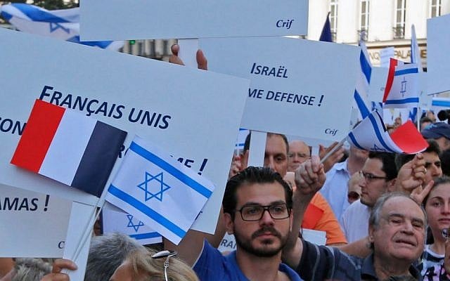 Demonstrators hold Israeli and French flags and placards reading 'French and All United Against Terrorism' during a gathering in front of the Israeli Embassy in Paris, France, Thursday, July 31, 2014. (AP Photo/Francois Mori ) Demonstrators hold Israeli and French flags and placards reading 'French and All United Against Terrorism' during a gathering in front of the Israeli Embassy in Paris, France, Thursday, July 31, 2014. (AP Photo/Francois Mori )