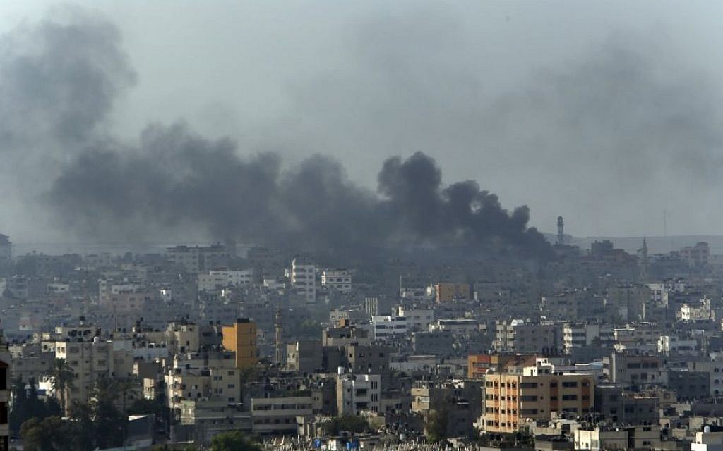 Smoke from Israeli strikes rise over Gaza City, northern Gaza Strip, Monday, July 21, 2014. (photo credit: AP Photo/Lefteris Pitarakis)