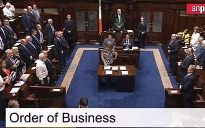 Gerry Adams (bottom left) leads a minute's silence for Gaza in the Irish parliament (Belfast Telegraph screenshot)