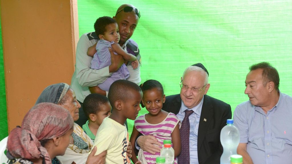 President Reuven Rivlin pays a visit to the family of a wounded soldier, Monday, July 28, 2014. (photo credit: Mark Neiman/GPO)