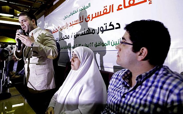 Osama Morsi, left, Shaimaa, center, and Abdullah, right, children of ousted Egyptian President Mohammed Morsi attend a press conference in Cairo, Egypt on July 22, 2013. (photo credit: AP Photo/Hassan Ammar, File) Osama Morsi, left, Shaimaa, center, and Abdullah, right, children of ousted Egyptian President Mohammed Morsi attend a press conference in Cairo, Egypt on July 22, 2013. (photo credit: AP Photo/Hassan Ammar, File)
