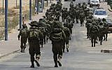 In this Monday, July 21, 2014 file photo, Israeli soldiers patrol the town of Sderot after a group of Hamas terrorists was detected infiltrating into Israel (AP/Tsafrir Abayov)