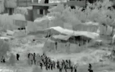 This image made from video released by the Israeli military on Friday, July 18, 2014 shows troops after crossing into the Gaza Strip at the beginning of a ground offensive Thursday, July 17, 2014. Israeli troops pushed deeper into Gaza on Friday to destroy rocket launching sites and tunnels (photo credit: AP Photo/Israeli Defense Forces via AP video)