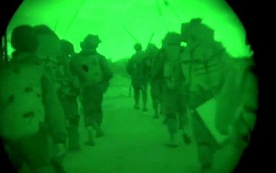 This image made from video shot through a night vision scope released by the Israeli military on Friday, July 18, 2014, shows troops during the early hours of a ground offensive in the Gaza Strip. (photo credit: AP Photo/Israeli Defense Forces) This image made from video shot through a night vision scope released by the Israeli military on Friday, July 18, 2014, shows troops during the early hours of a ground offensive in the Gaza Strip. (photo credit: AP Photo/Israeli Defense Forces)