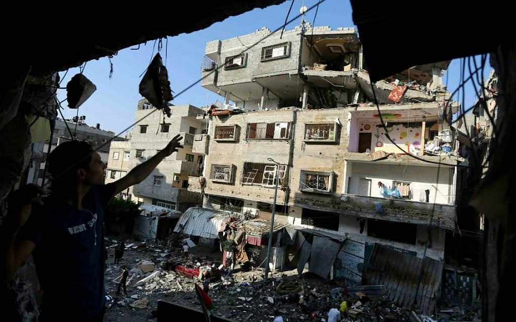Palestinians inspect the rubble of a house after it was hit by an Israeli missile strike in Gaza City, Thursday, July 10, 2014. (AP Photo/Hatem Moussa) Palestinians inspect the rubble of a house after it was hit by an Israeli missile strike in Gaza City, Thursday, July 10, 2014. (AP Photo/Hatem Moussa)