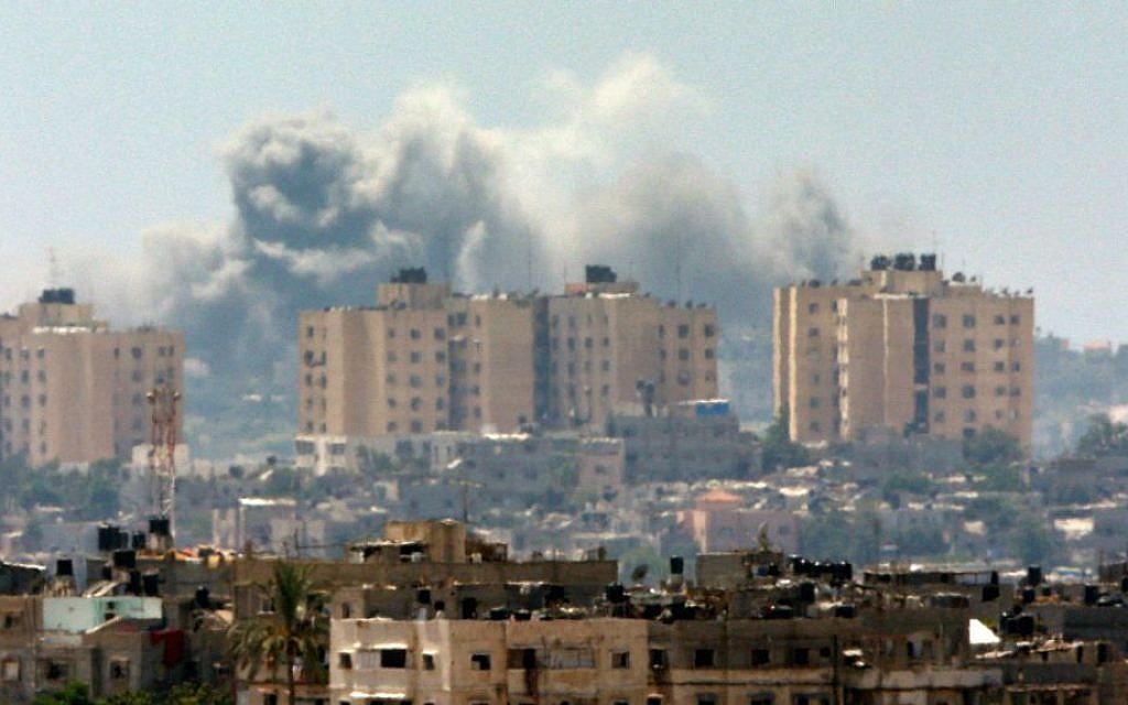 Smoke rises following an Israeli strike on Gaza, seen from the Israel-Gaza Border, Thursday, July 10, 2014. (AP Photo/Lefteris Pitarakis)