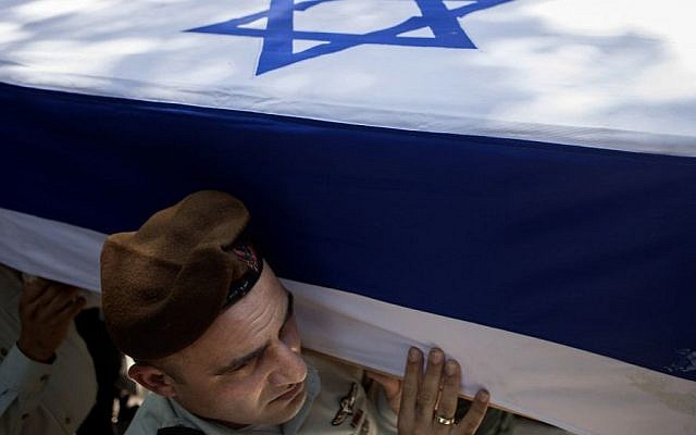 Israeli soldiers carry the coffin of Maj. Tzafrir Bar-Or, 32, one of 13 soldiers who were killed in several separate incidents in Shejaiya on Sunday, July 20, 2014, at the military cemetery in Holon, Monday, July 21, 2014. . (Photo credit: AP/Dan Balilty) Israeli soldiers carry the coffin of Maj. Tzafrir Bar-Or, 32, one of 13 soldiers who were killed in several separate incidents in Shejaiya on Sunday, July 20, 2014, at the military cemetery in Holon, Monday, July 21, 2014. . (Photo credit: AP/Dan Balilty)