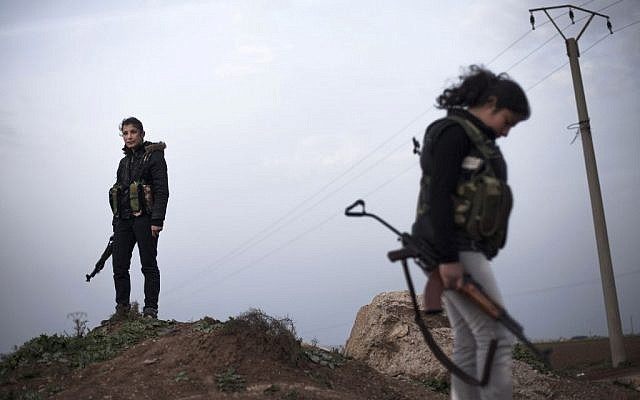 Kurdish female members of the Popular Protection Units stand guard at a check point near the northeastern city of Qamishli, Syria, March 3, 2013. (AP/Manu Brabo) Kurdish female members of the Popular Protection Units stand guard at a check point near the northeastern city of Qamishli, Syria, March 3, 2013. (AP/Manu Brabo)