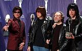 In this March 18, 2002, file photo, members of the Ramones, from left to right, Dee Dee, Johnny, Tommy and Marky Ramone hold their awards after being inducted at the Rock and Roll Hall of Fame induction ceremony at New York's Waldorf Astoria. (photo credit: AP/Ed Betz, File)
