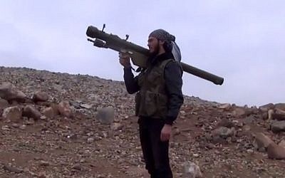 Screen capture from a video allegedly showing a Syrian rebel with an SA-7 anti-aircraft missile. (screen capture: YouTube/gresh775)