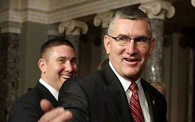 In this Feb. 11, 2014, file photo, Sen. John Walsh, D-Mont., right, and his son Michael leave the Old Senate Chamber on Capitol Hill in Washington, after a ceremonial swearing-in ceremony with Vice President Joe Biden. (AP Photo/Lauren Victoria Burke, File)