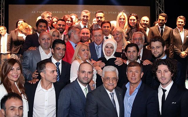 Turkey's Prime Minister Recep Tayyip Erdogan, center in third row, and Palestinian Authority President Mahmoud Abbas, front center, with Turkish artists who joined them in a show of support for the Palestinian people, in Istanbul, Turkey, Friday, July 18, 2014. (photo credit: AP Photo/Kayhan Ozer, Turkish Prime Minister's Press Office, HO) Turkey's Prime Minister Recep Tayyip Erdogan, center in third row, and Palestinian Authority President Mahmoud Abbas, front center, with Turkish artists who joined them in a show of support for the Palestinian people, in Istanbul, Turkey, Friday, July 18, 2014. (photo credit: AP Photo/Kayhan Ozer, Turkish Prime Minister's Press Office, HO)
