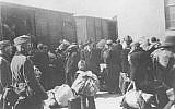 This handout photo provided by the United States Holocaust Memorial Museum shows Aleksander Belev, center, facing camera, the Bulgarian Commissioner for Jewish Questions, overseeing the deportation of Macedonian Jews from Bulgarian-occupied Skopje, Yugoslavia, in March 1943. (AP/Central Zionist Archives via the United States Holocaust Memorial Museum)
