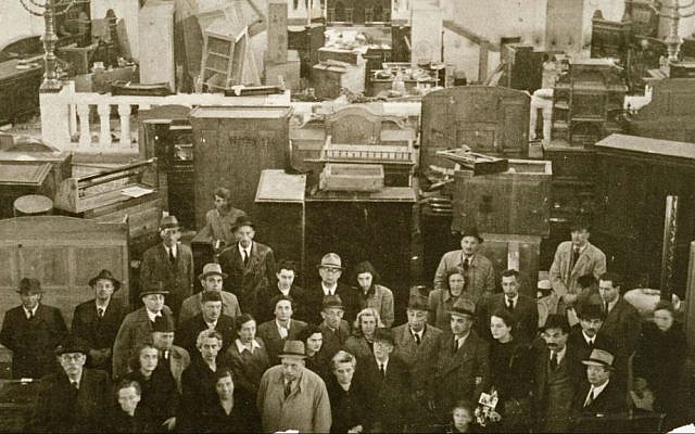 This photo, date unknown, provided by United States Holocaust Memorial Museum, shows Jews assembled in the desecrated synagogue in Novi Sad, Yugoslavia, before being transported to a concentration camp. A largely unknown archive documenting thousands of cases against World War II criminals, from Hitler to many average participants in the Holocaust who were never brought to trial, are being made public and unrestricted for the first time at the U.S. Holocaust Memorial Museum in Washington after being locked away for decades at the United Nations. (AP Photo/United States Holocaust Memorial Museum)