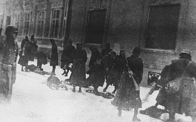 This photo provided by United States Holocaust Memorial Museum shows Hungarian soldiers as they execute Serbians and Jews on Miletic Street in Novi Sad, Yugoslavia, January 23, 1942. (AP Photo/Jewish Historical Museum, Belgrade via United States Holocaust Memorial Museum)