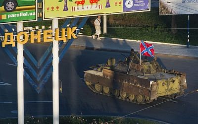 A Donetsk People's Republic APC moves through the city of Donetsk, eastern Ukraine Sunday, July 27, 2014. (photo credit: AP/Dmitry Lovetsky)