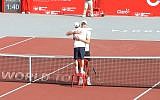 Israeli tennis player Dudi Sela embraces Croatian Ivo Karlovic (screen capture: YouTube)