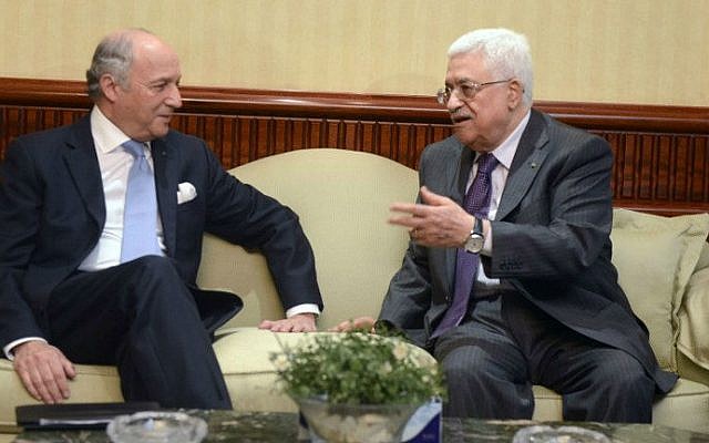 A handout picture released by the Palestinian president's office (PPO) shows Palestinian leader Abbas (R) meeting with French Foreign Minister Laurent Fabius ahead of a meeting in Cairo on July 18, 2014 (photo credit: AFP/PPO/Thaer Ghanem) A handout picture released by the Palestinian president's office (PPO) shows Palestinian leader Abbas (R) meeting with French Foreign Minister Laurent Fabius ahead of a meeting in Cairo on July 18, 2014 (photo credit: AFP/PPO/Thaer Ghanem)