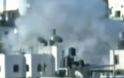 Smoke billows from the apartment of Ziad Awad in the West Bank village of Idhna. Awad has been indicted for the April 14 murder of Israeli police officer Baruch Mizrahi. (screen capture: YouTube)