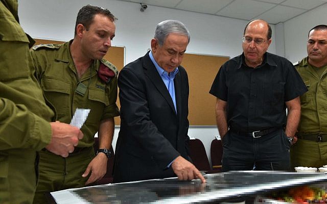 Prime Minister Benjamin Netanyahu and Defense Minister Moshe Yaalon consult at the IDF's Southern Command (photo credit: Ariel Hermoni/Defense Ministry)