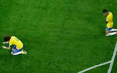Brazil's David Luiz, left and Luiz Gustavo react after the World Cup semifinal soccer match between Brazil and Germany at the Mineirao Stadium in Belo Horizonte, Brazil, Tuesday, July 8, 2014 (photo credit: AP/Felipe Dana, Pool) Brazil's David Luiz, left and Luiz Gustavo react after the World Cup semifinal soccer match between Brazil and Germany at the Mineirao Stadium in Belo Horizonte, Brazil, Tuesday, July 8, 2014 (photo credit: AP/Felipe Dana, Pool)