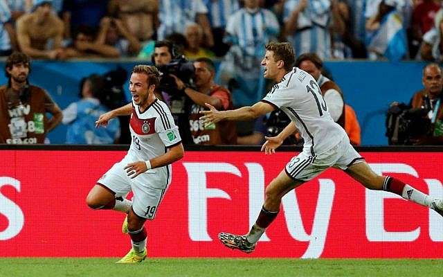 Germany's Mario Goetze, left, celebrates with Thomas Mueller after scoring the winning goal during the World Cup final soccer match between Germany and Argentina at the Maracana Stadium in Rio de Janeiro, Brazil, Sunday, July 13, 2014. (photo credit: AP/Frank Augstein) Germany's Mario Goetze, left, celebrates with Thomas Mueller after scoring the winning goal during the World Cup final soccer match between Germany and Argentina at the Maracana Stadium in Rio de Janeiro, Brazil, Sunday, July 13, 2014. (photo credit: AP/Frank Augstein)