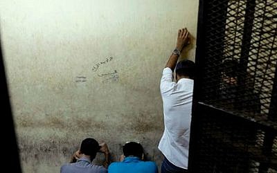 Illustrative photo: Egyptian men attend their trial at a court in Cairo, Egypt, Wednesday, July 16, 2014 (AP/Aly Hazzaa, El Shorouk)