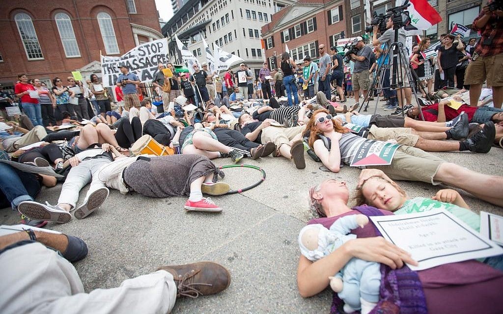 Pro-Palestinian activists staged a 'die-in' against Israel on the Boston Common yesterday (photo credit: Elan Kawesch/The Times of Israel) Pro-Palestinian activists staged a 'die-in' against Israel on the Boston Common yesterday (photo credit: Elan Kawesch/The Times of Israel)