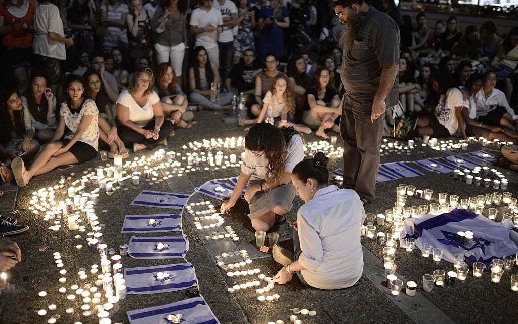 Israelis light candles in Tel Aviv's Rabin Square, as they mourn the killing of three abducted teenagers, Monday, June 30, 2014 (photo credit: Tomer Neuberg/Flash90) Israelis light candles in Tel Aviv's Rabin Square, as they mourn the killing of three abducted teenagers, Monday, June 30, 2014 (photo credit: Tomer Neuberg/Flash90)