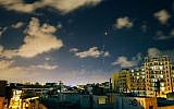 An Iron Dome interceptor rocket flies above the Tel Aviv skyline (photo credit: Matanya Tausig/Flash 90)
