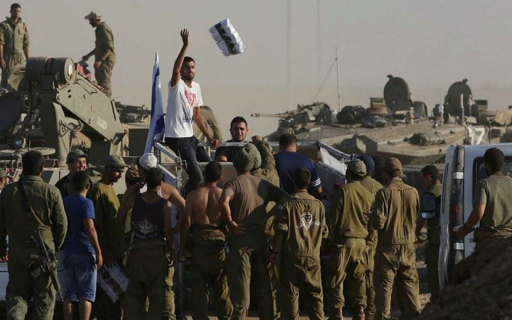 Distributing care packages to troops, during the current operation in Gaza. (photo credit: Nati Shochat/Flash90) Distributing care packages to troops, during the current operation in Gaza. (photo credit: Nati Shochat/Flash90)