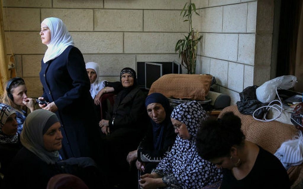 Friends and relatives of Muhammad Abu Khdeir, the Palestinian teen found dead in the Jerusalem Forest, mourn in the family home in Shuafat, East Jerusalem, on July 2, 2014. (photo credit: Hadas Parush/Flash90)