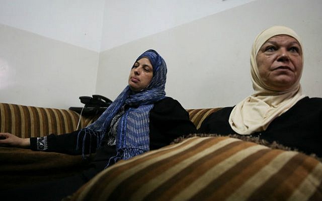 The mother of Muhammad Abu Khader (L), a Palestinian teen found dead in the Jerusalem Forest, speaks with media in the family home in Shuafat, East Jerusalem, on July 2, 2014 (photo credit: Hadas Parush/Flash90) 
