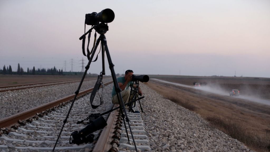 An Israeli press photographer documenting the movement of IDF forces near the border with Gaza, in southern Israel, on July 23, 2014. (photo credit: Nati Shohat/Flash90) Illustrative: An Israeli press photographer documenting the movement of IDF forces near the border with Gaza, in southern Israel, on July 23, 2014. (photo credit: Nati Shohat/Flash90)