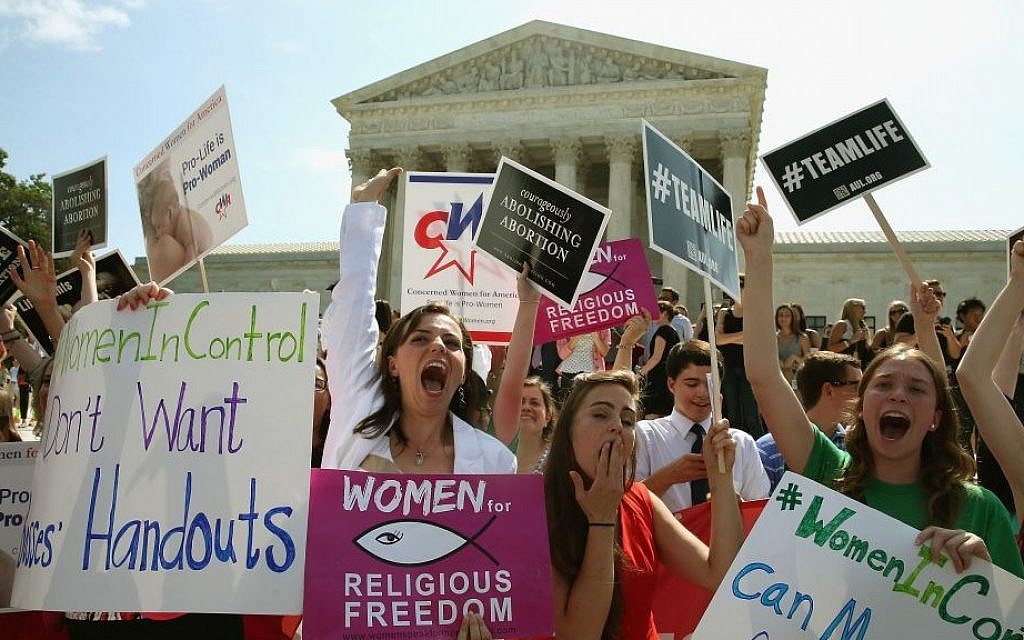 Demonstrators in Washington celebrate the US Supreme Court decision in the Hobby Lobby case, June 30, 2014. (Mark Wilson/Getty Images/via JTA) Demonstrators in Washington celebrate the US Supreme Court decision in the Hobby Lobby case, June 30, 2014. (Mark Wilson/Getty Images/via JTA)