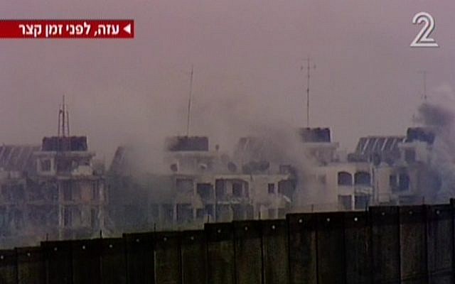 A row of buildings on a ridge in Jabaliya in Gaza being bombed Monday. (Screen capture: Channel 2)