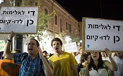 Participants in an anti-racism rally in Jerusalem holding signs that say, "Enough violence. Yes to co-existence," July 7, 2014. (photo credit: Noam Revkin Fenton/Flash 90)