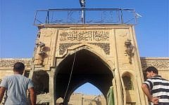 People inspect the destroyed Mosque of the Prophet Younis, or Jonah, in Mosul, Iraq, on July 24, 2014. (AP)