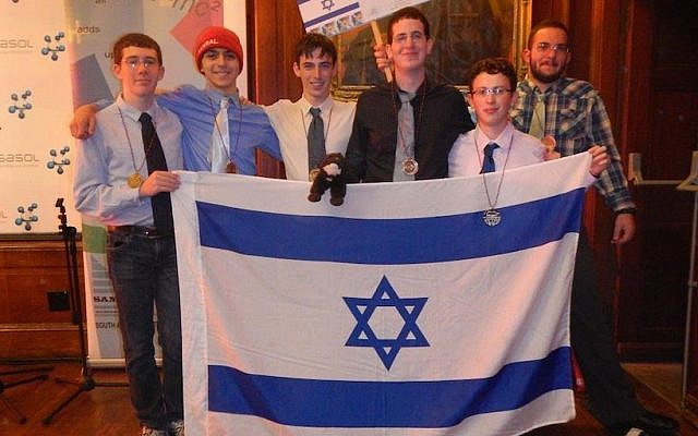 (L to R, holding the flag) Team members Tomer Novikov, Dor Shmoish, Nitzan Tor, David Metzer, Amotz Oppenheim, Omri Solan. Background right: Lev Radizolonsky, team coach (Photo credit: Courtesy) (L to R, holding the flag) Team members Tomer Novikov, Dor Shmoish, Nitzan Tor, David Metzer, Amotz Oppenheim, Omri Solan. Background right: Lev Radizolonsky, team coach (Photo credit: Courtesy)