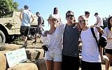 In this June 2012 photo courtesy of Stuart Steinberg, Max Steinberg, right, poses while on a trip to Israel with his siblings Paige Steinberg, left, and Jake Steinberg.  (photo credit: AP Photo/Courtesy of Stuart Steinberg)
