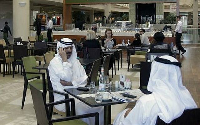 In this Wednesday, May 21, 2014 photo, Emirati and other customers enjoy their free time at the Bateel Cafe in Dubai, United Arab Emirates (photo credit: AP/Kamran Jebreili) In this Wednesday, May 21, 2014 photo, Emirati and other customers enjoy their free time at the Bateel Cafe in Dubai, United Arab Emirates (photo credit: AP/Kamran Jebreili)