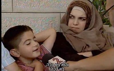 9-year-old Musa Zalum, who was nearly kidnapped by Muhammad Abu Khdeir's murderers the day before, reenacts the event (screen capture: Channel 2)
