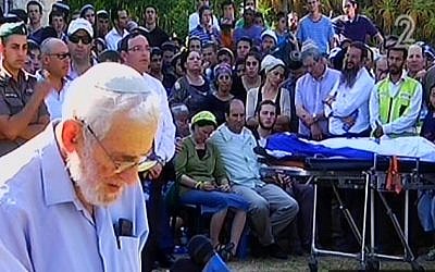 The grandfather of Naftali Fraenkel speaking at his funeral while his bodies lies draped in an Israeli flag in front of his parents in Nof Ayalon Tuesday. (Screen capture: Channel 2) The grandfather of Naftali Fraenkel speaking at his funeral while his bodies lies draped in an Israeli flag in front of his parents in Nof Ayalon Tuesday. (Screen capture: Channel 2)