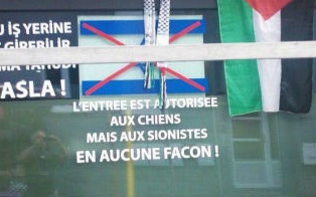 A sign reading 'dogs are allowed in this establishment, Jews are not under any circumstances” in a cafe near Liege in July 2014 (JTA/LBCA) A sign reading 'dogs are allowed in this establishment, Jews are not under any circumstances” in a cafe near Liege in July 2014 (JTA/LBCA)