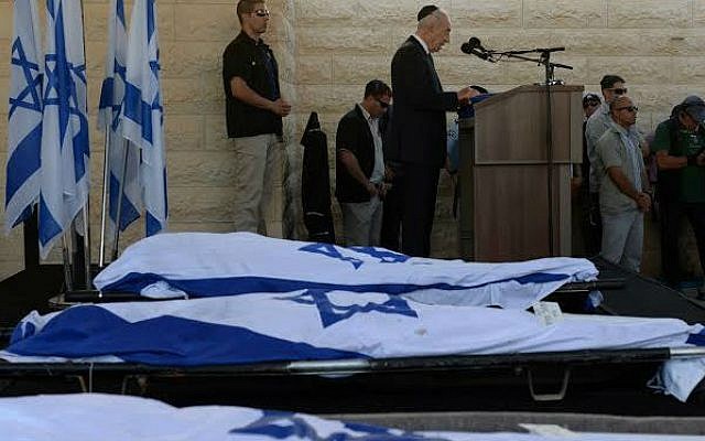 President Shimon Peres delivering a eulogy next to the flag-draped bodies of Naftali Fraenkel, Gil-ad Shaar and Eyal Yifrach at their funeral July 1, 2014 (photo credit: Chaim Tzach) President Shimon Peres delivering a eulogy next to the flag-draped bodies of Naftali Fraenkel, Gil-ad Shaar and Eyal Yifrach at their funeral July 1, 2014 (photo credit: Chaim Tzach)