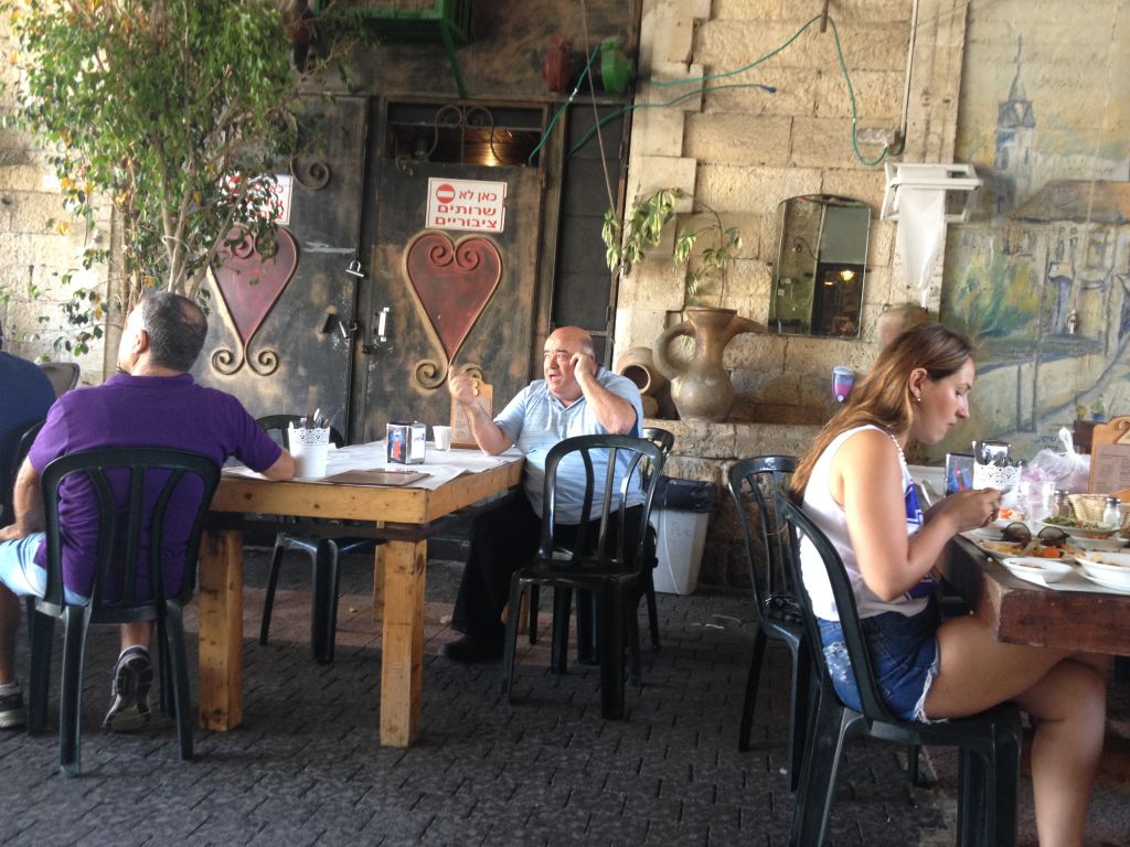 Dr. Shakshuka owner Bino Gabzo says business has been rough, but he's seen it all before (photo credit: Jessica Steinberg/Times of Israel)