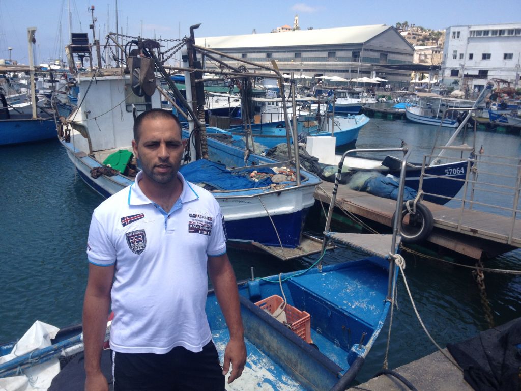 Dudu Sahifi is frustrated by empty nets and a lack of access to his regular customers in Gaza (photo credit: Jessica Steinberg/Times of Israel)