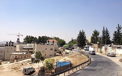 A view of a main street in Jabel Mukaber, one of the Arab villages abutting Armon Hanatziv (photo credit: Jessica Steinberg/Times of Israel)