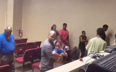 Church members 'evacuate' their sanctuary during a solidarity drill. (YouTube screenshot)